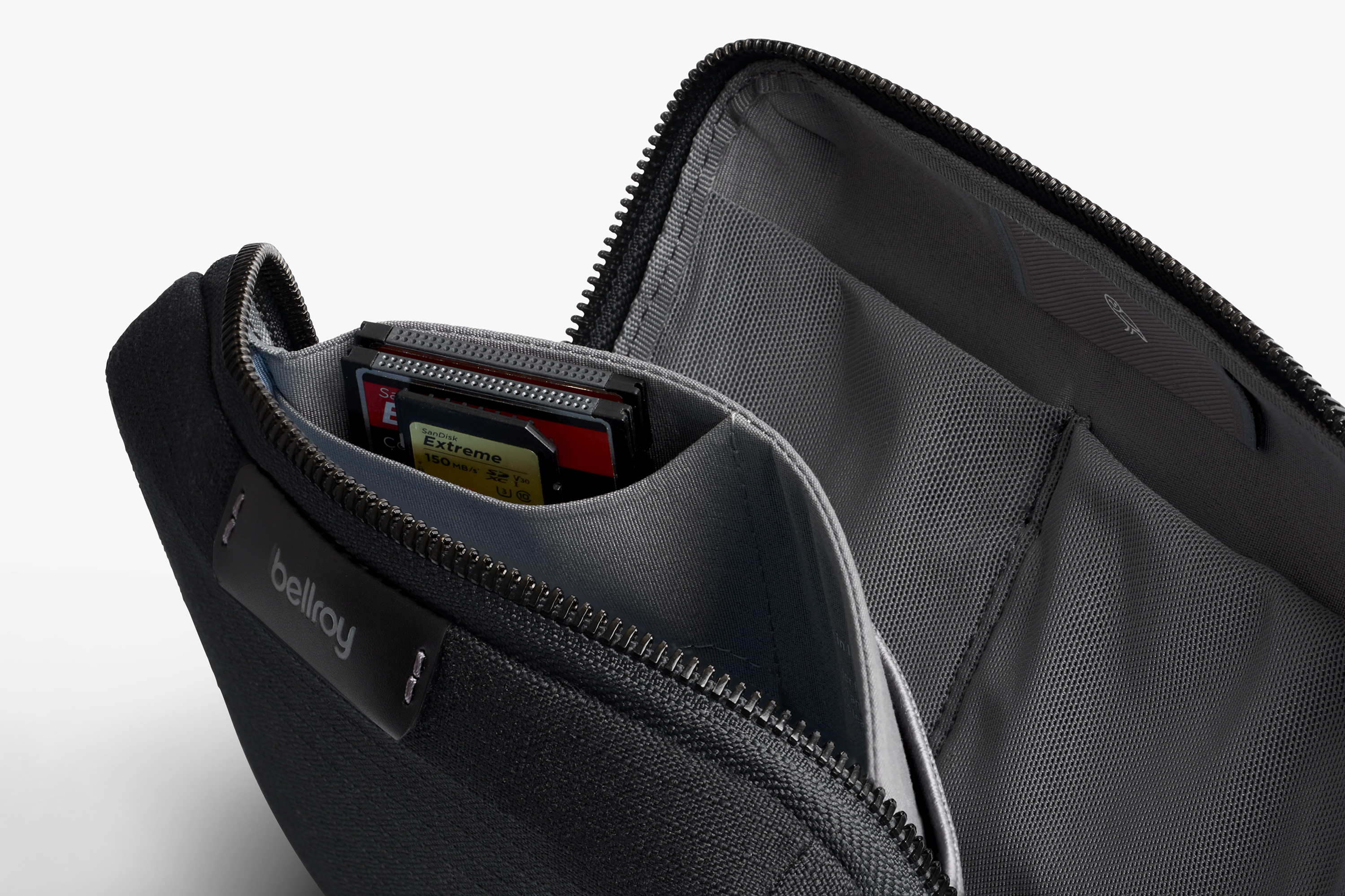Product gallery image of the Bellroy Tech Kit Compact made from recycled ripstop with organized compartments and a mesh pocket.