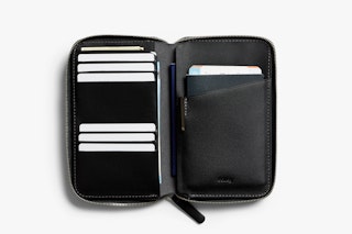 Opened black Bellroy Travel Folio on a white background, with card slots, a large pocket for passport and travel documents.